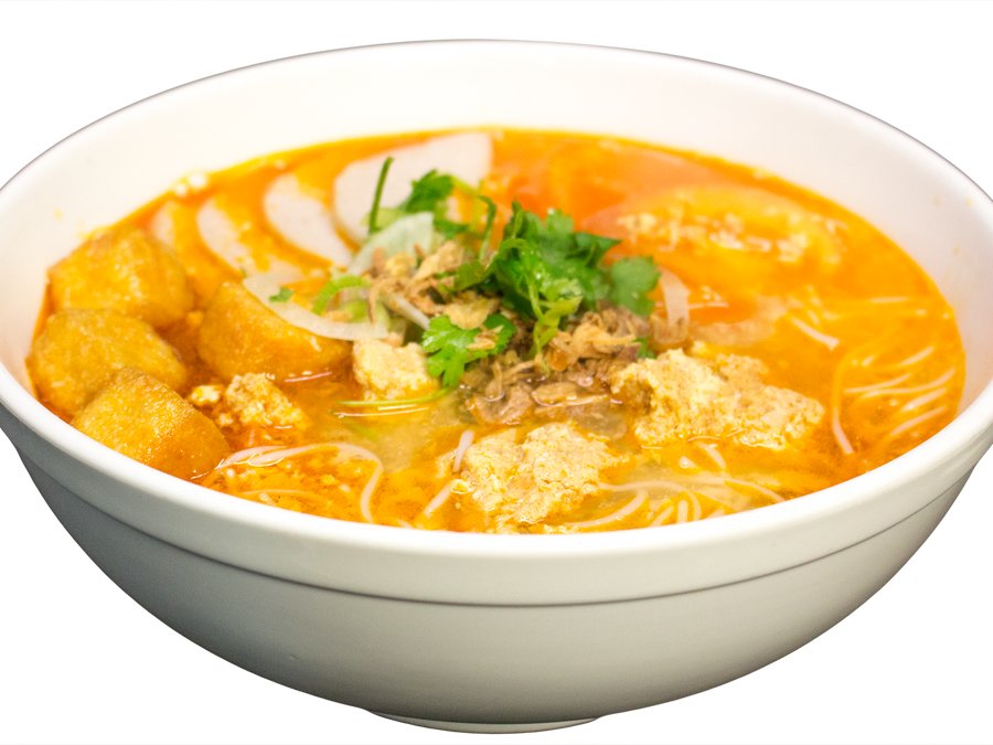 A steaming bowl of Ly's phở with fresh herbs